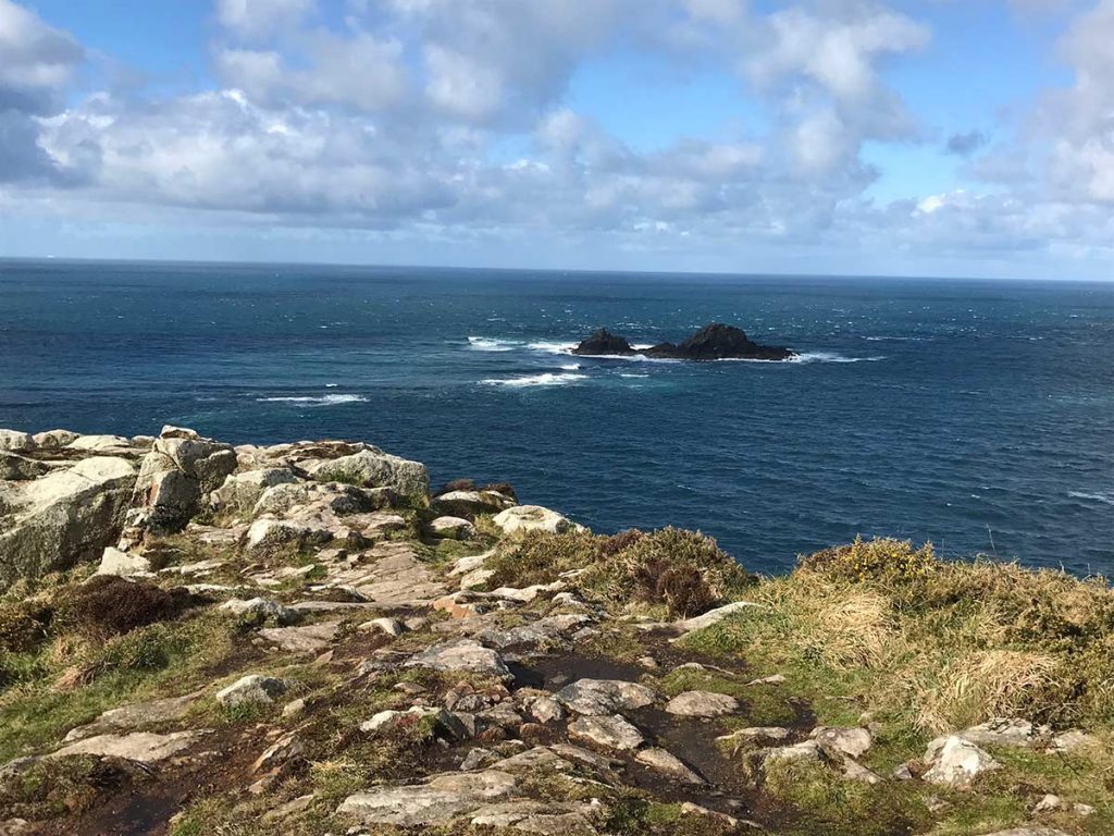 Peaceful dark blue sea at National Trust's Cape Cornwall